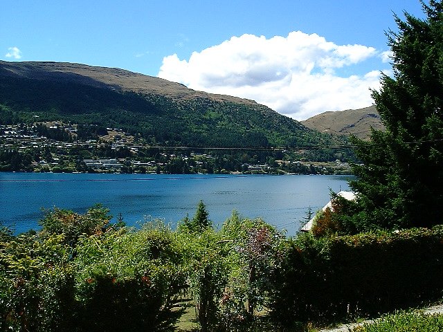 a scenic view looking over water and mountains