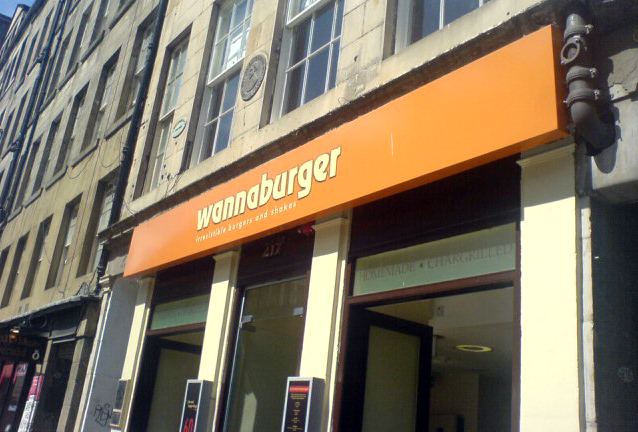 storefront of a building with a sign saying hamburger