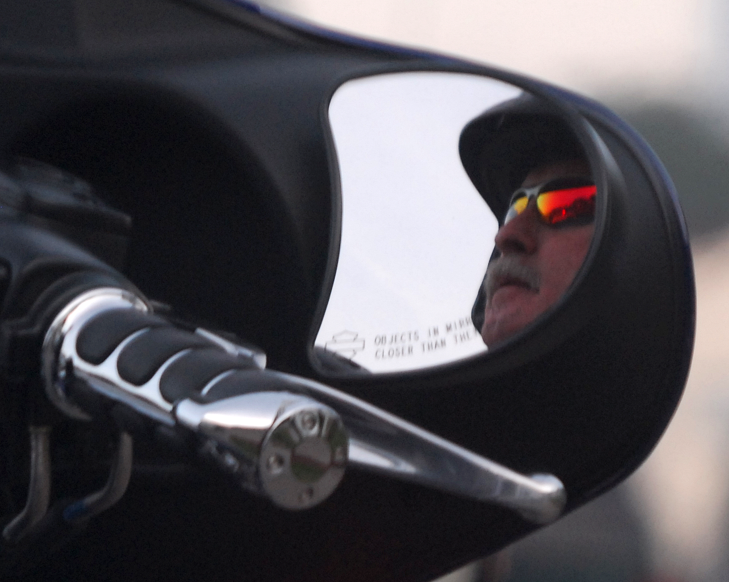 a close up of the mirror of a motorcycle