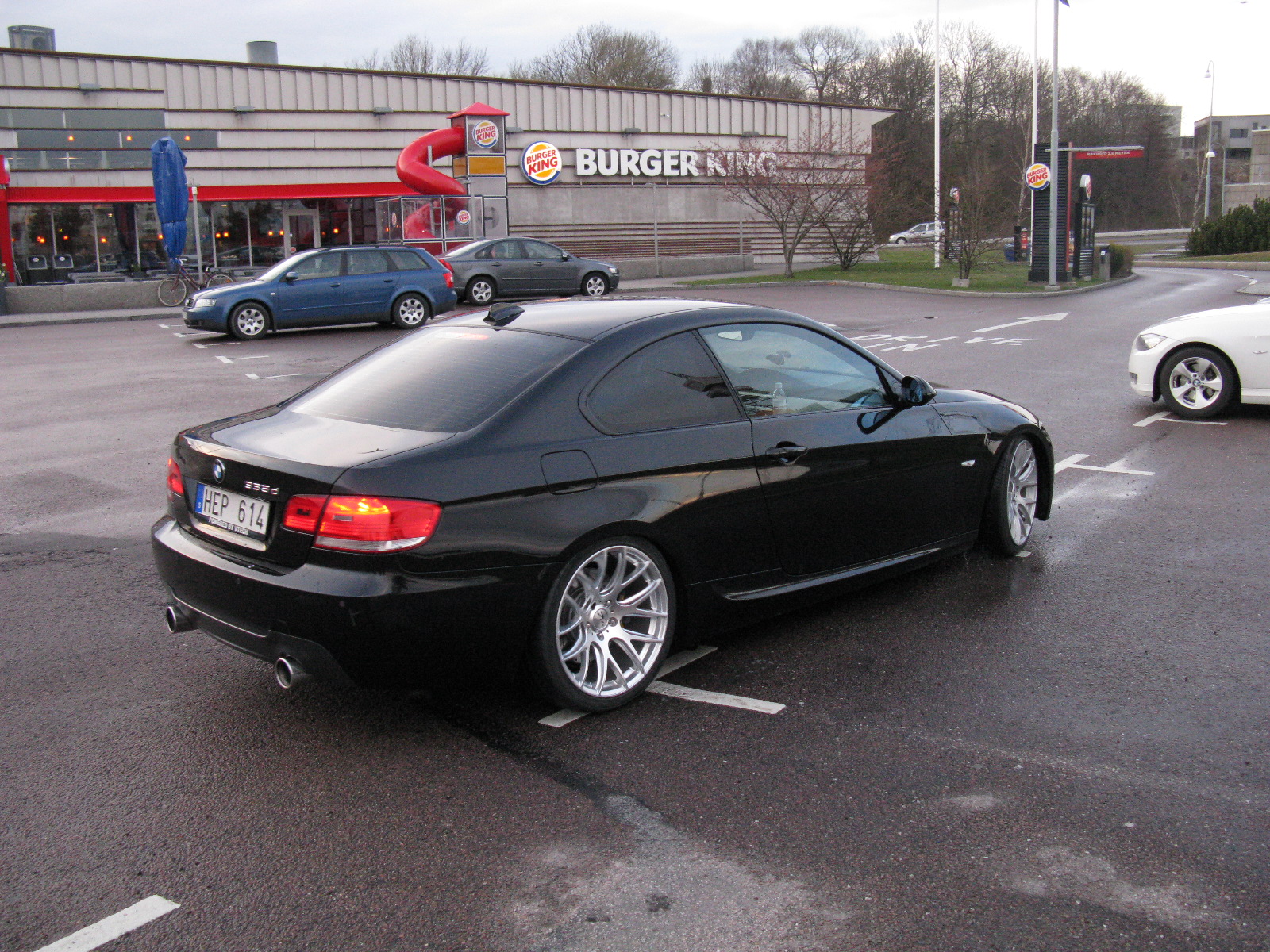 a couple of cars parked in a parking space