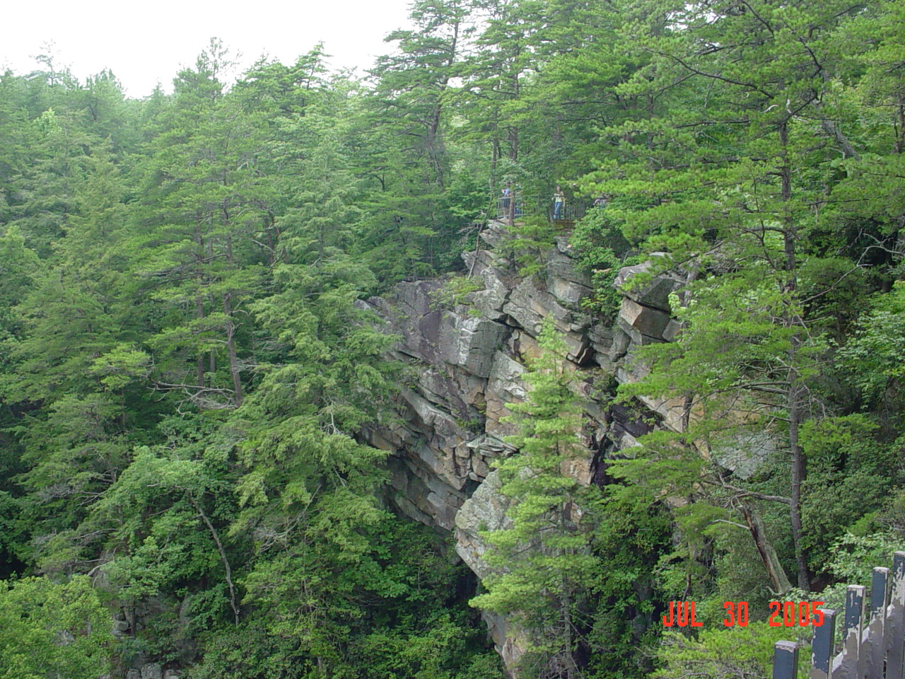 this is a man climbing up a large rock