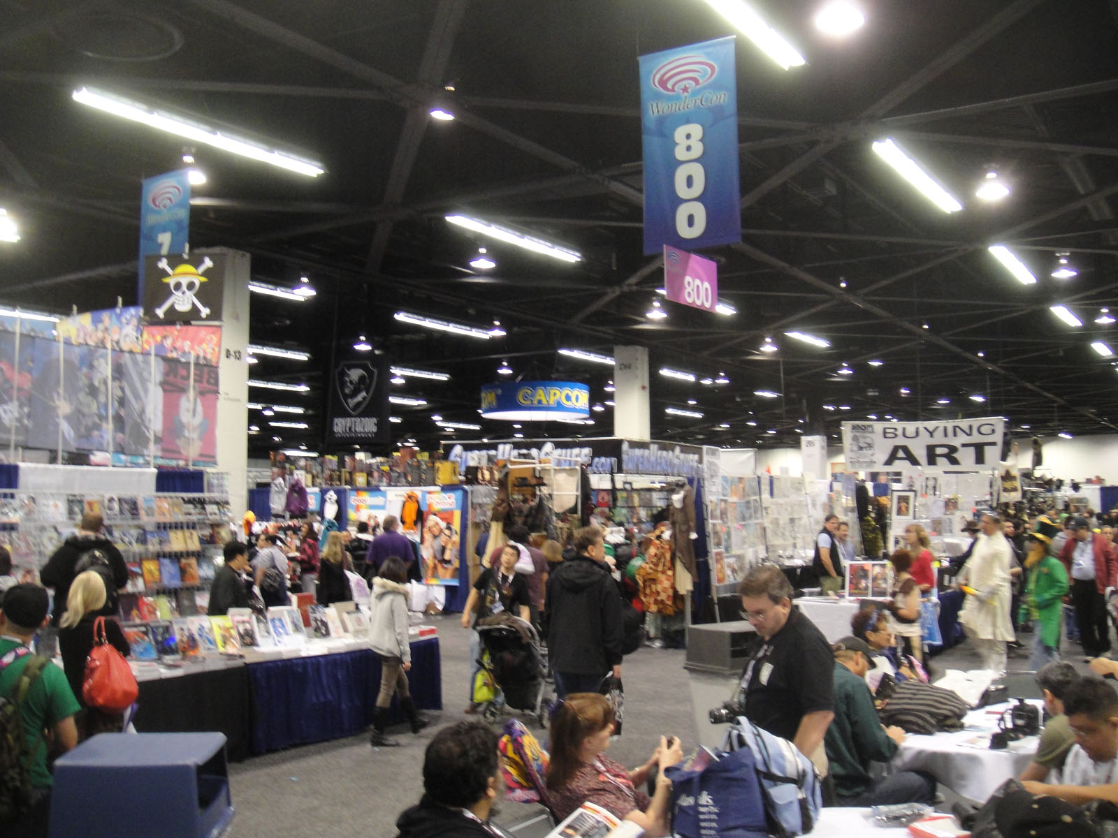 many people gathered around a large book fair