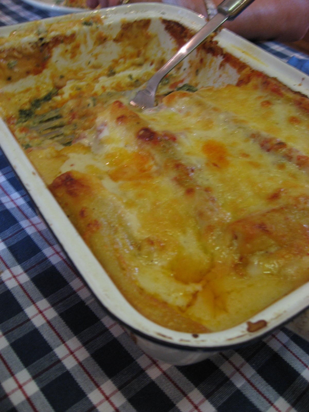 this dish is casserole made with cheese, meat and greens