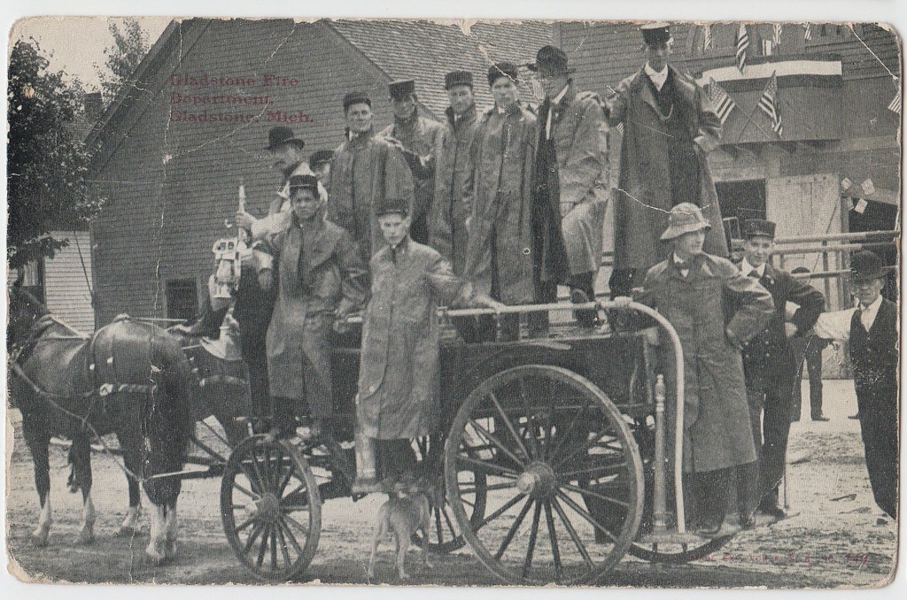 a group of people standing on top of a cart