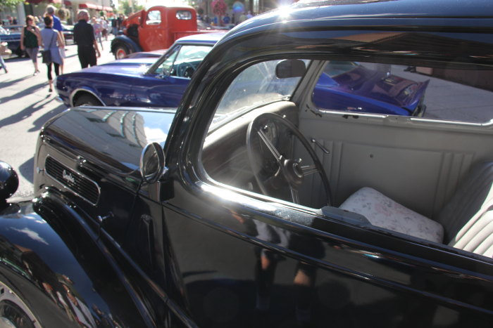 the inside of a classic car is parked