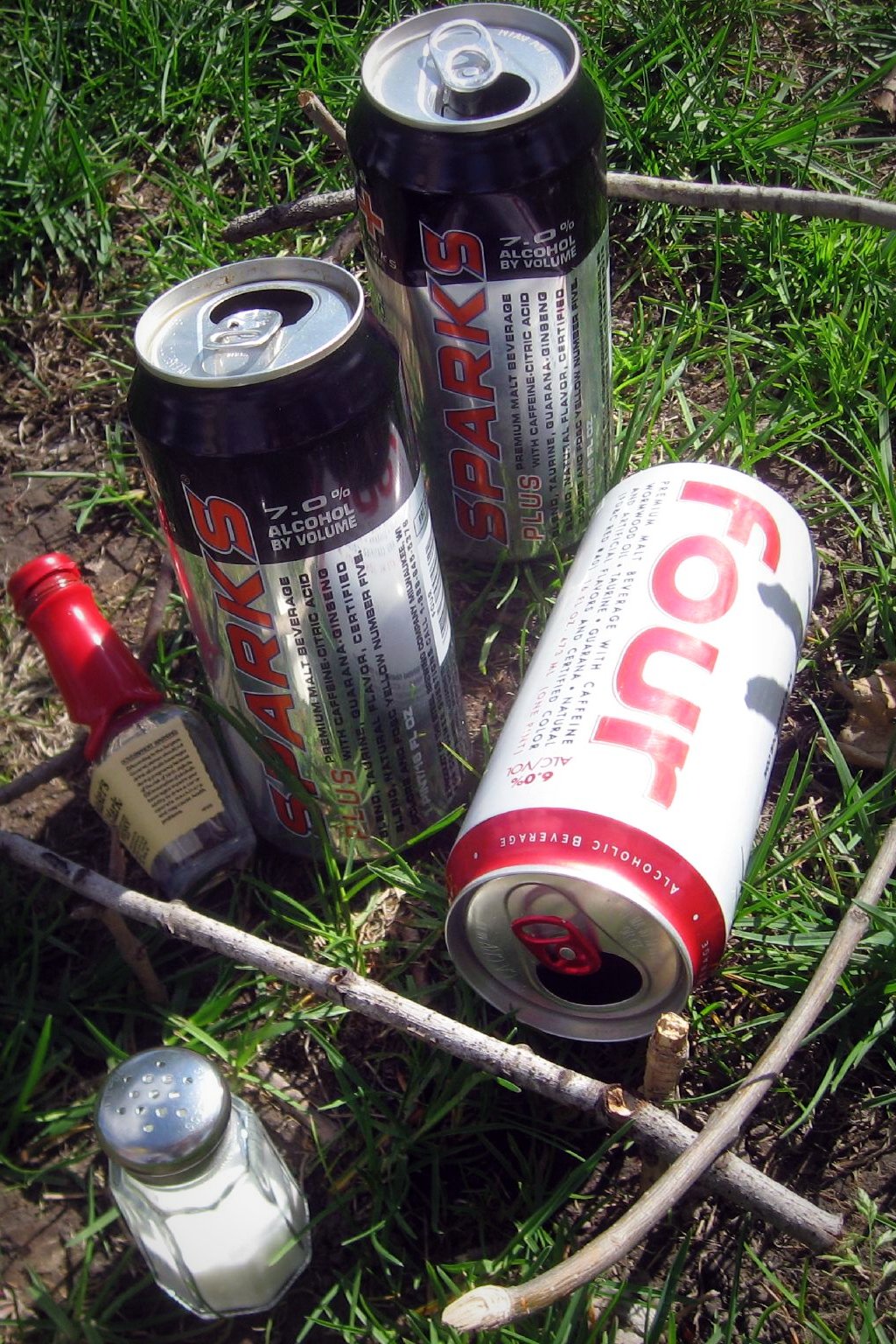 an assortment of cans and cans on the ground