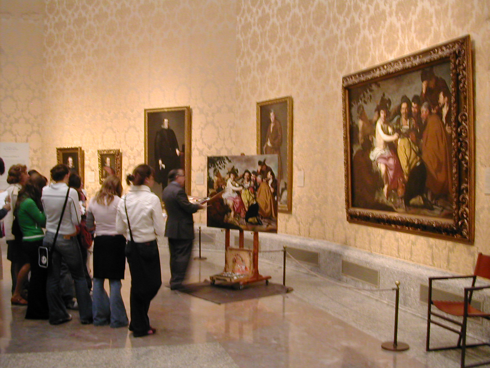 many people look at a couple of paintings