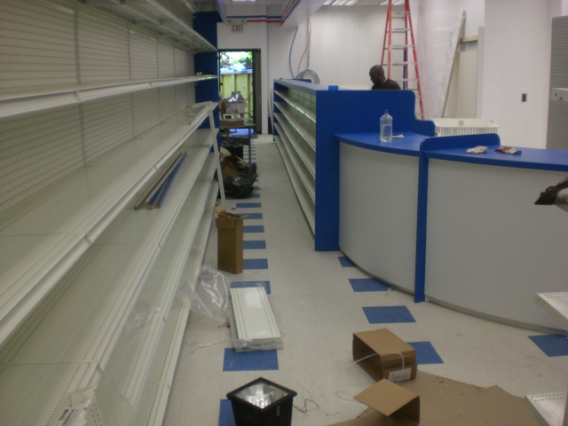 an empty grocery store filled with merchandise and boxes