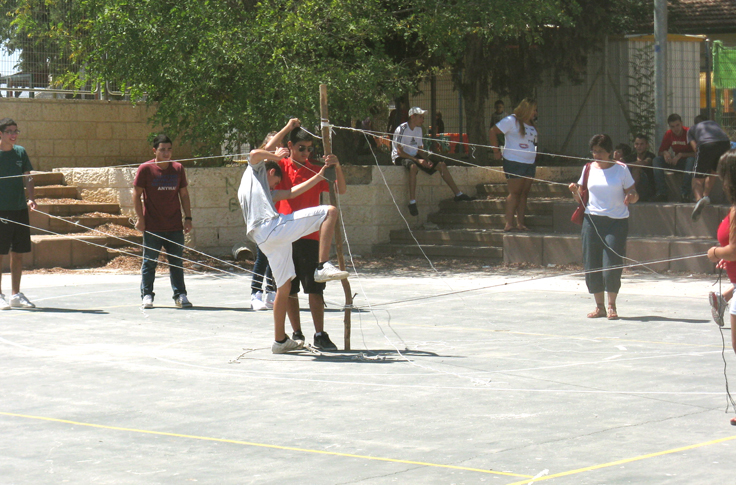 some people playing a game of volleyball on a court