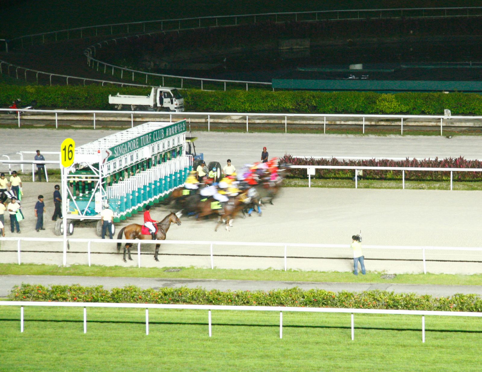 a horse racing game is being played on an open track