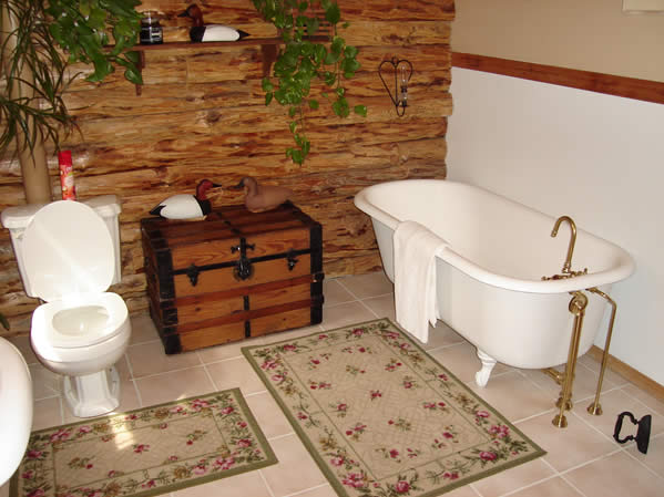a white bathtub sitting next to a toilet and sink