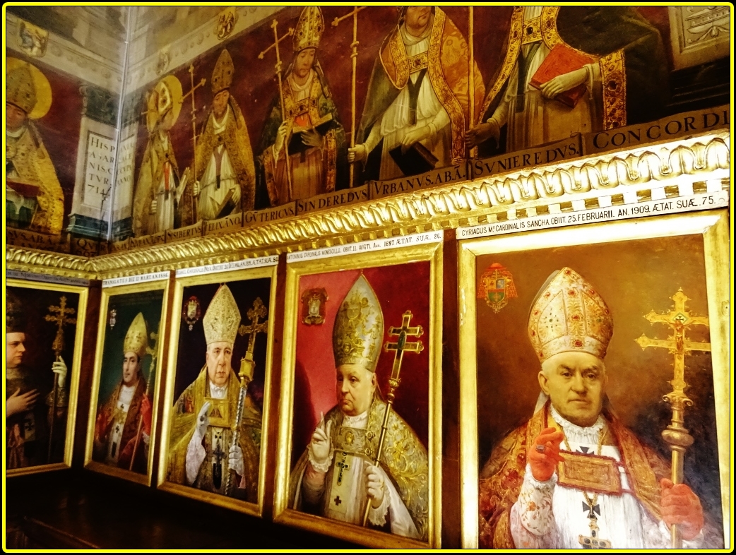 an assortment of framed religious pictures of the pope of england