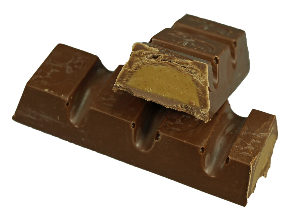 a close up of chocolate bars with a piece missing