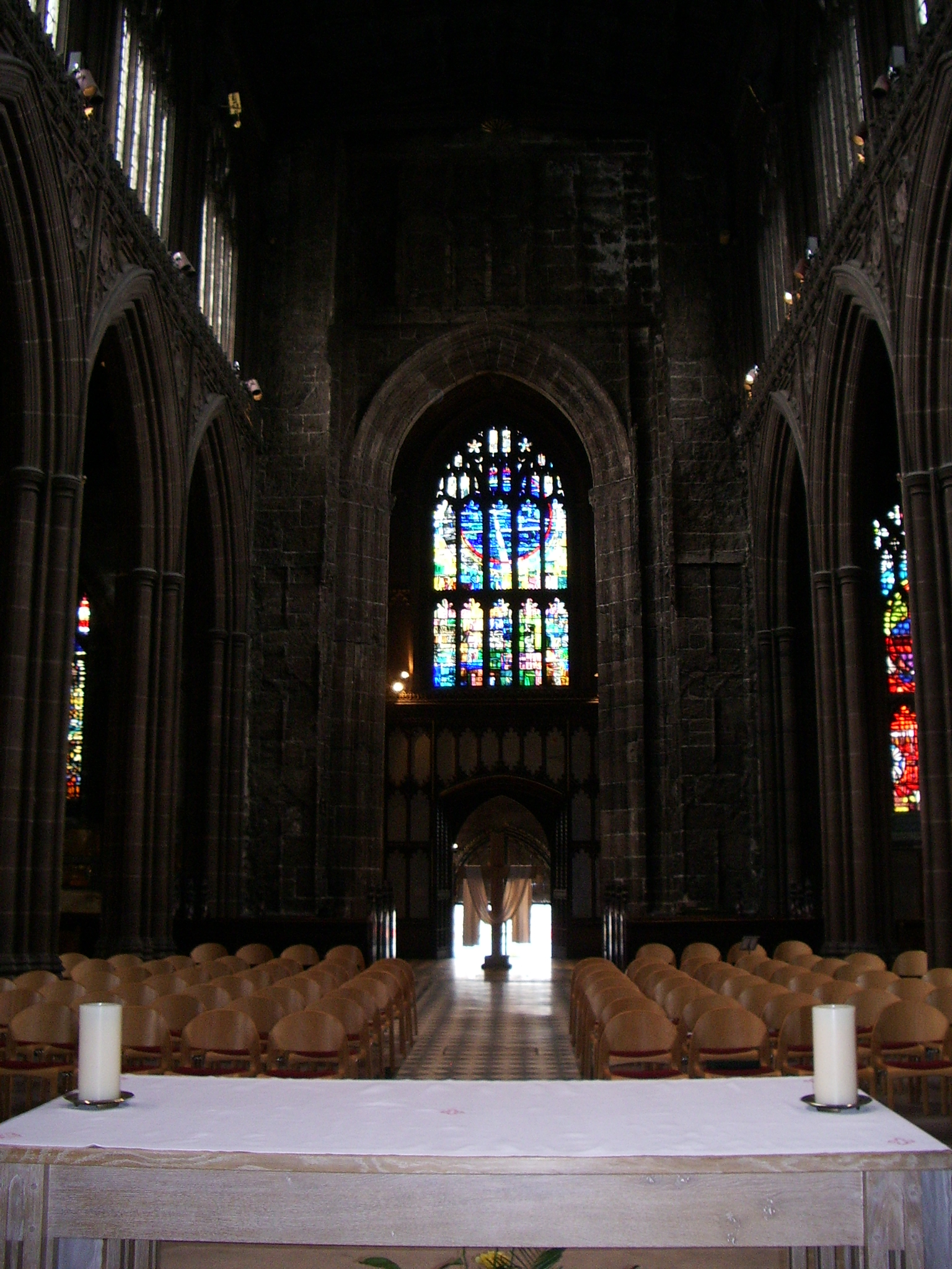 a large cathedral with two columns and stained glass