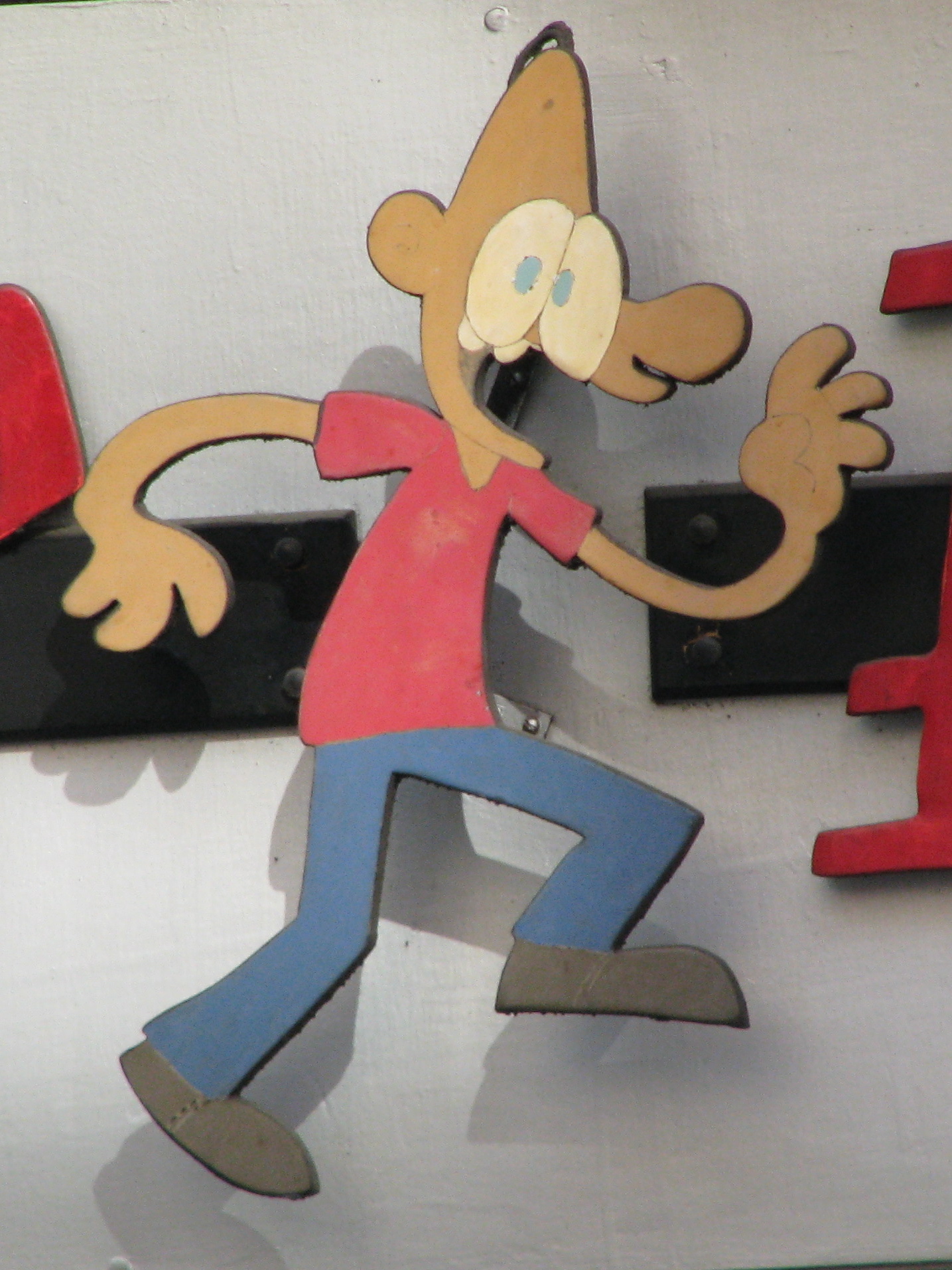 a wood cutout picture of a cartoon character