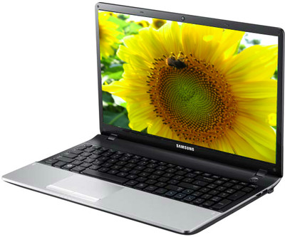 the back view of a laptop computer showing a large yellow flower