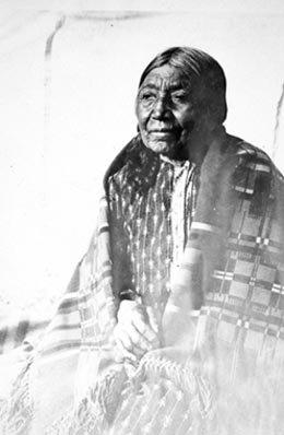 an old native american man sitting down