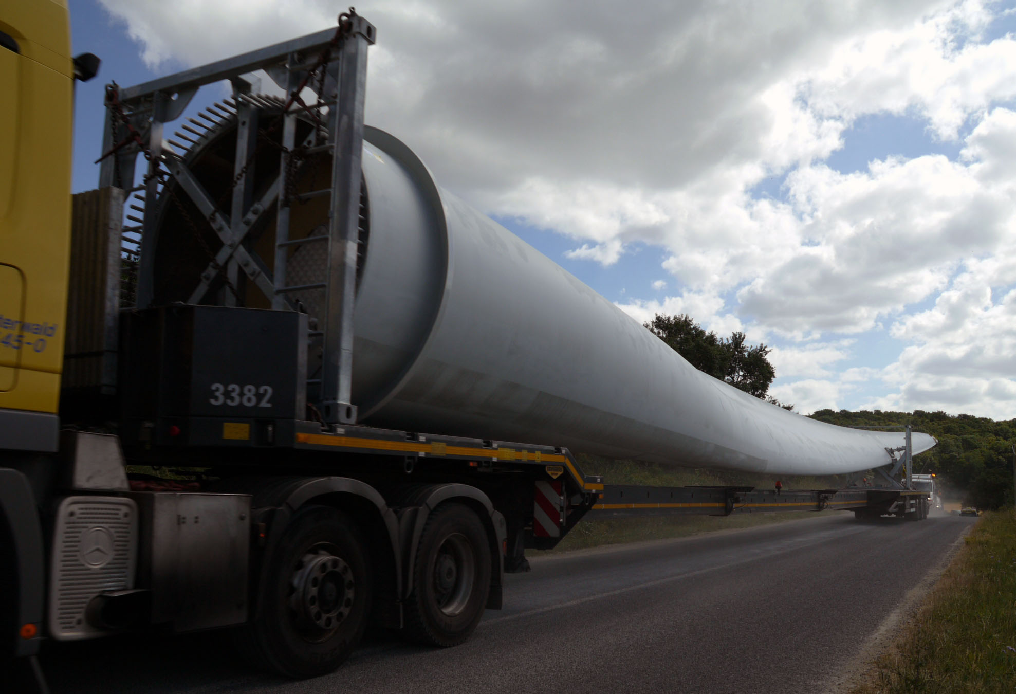 a tanker truck is driving down the road