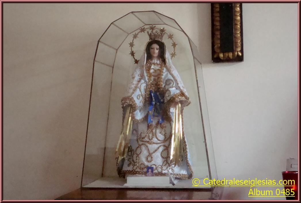 statue of the immaculate mary inside a chapel