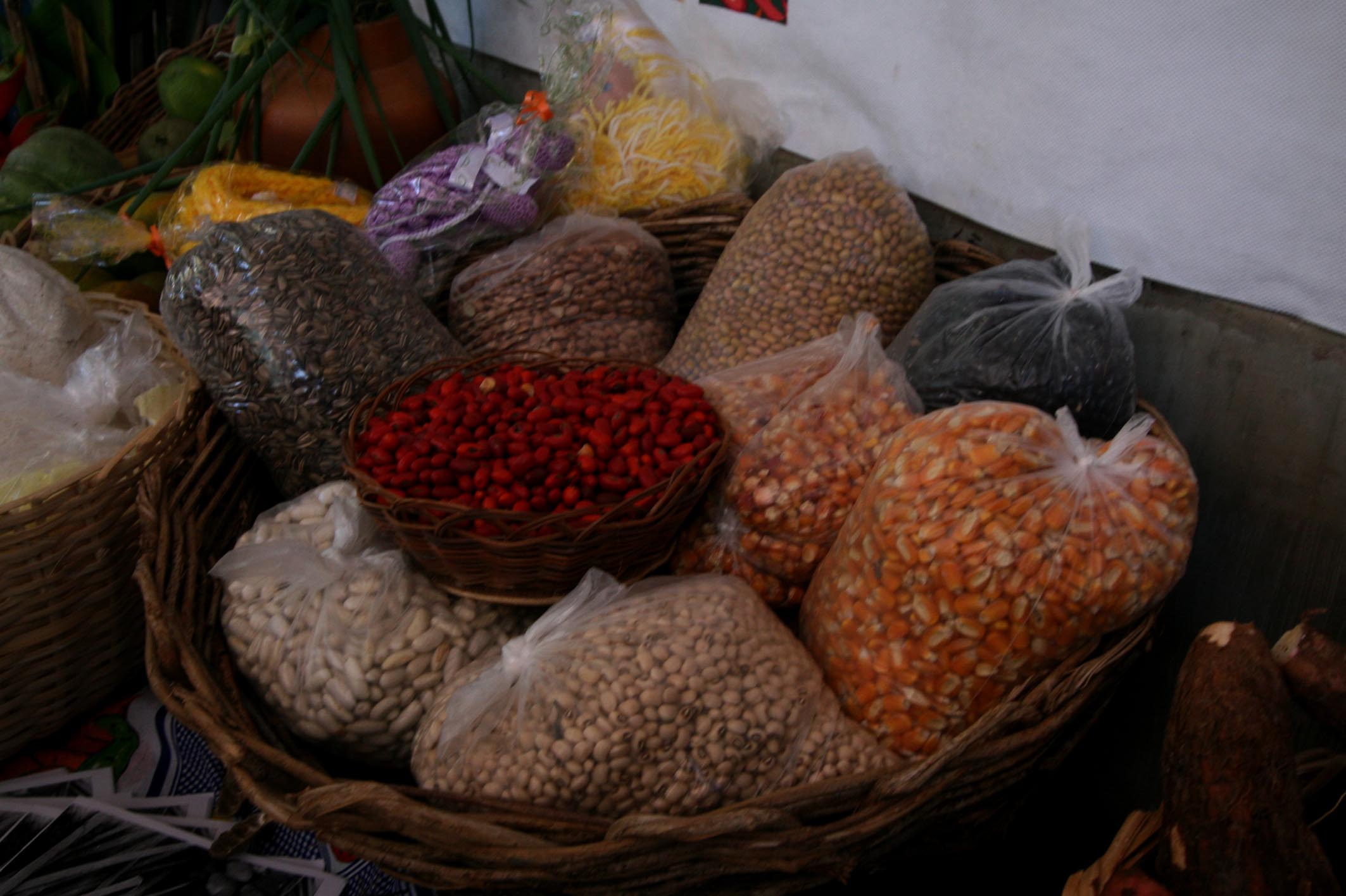 baskets filled with bean and rice items in a market