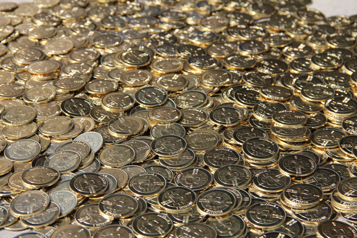 a large collection of pound coins arranged together