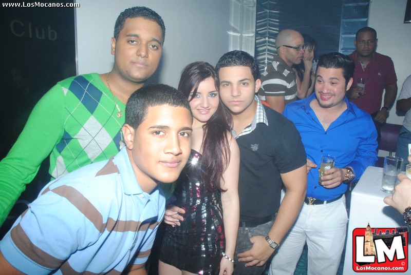 a group of people pose together at a party