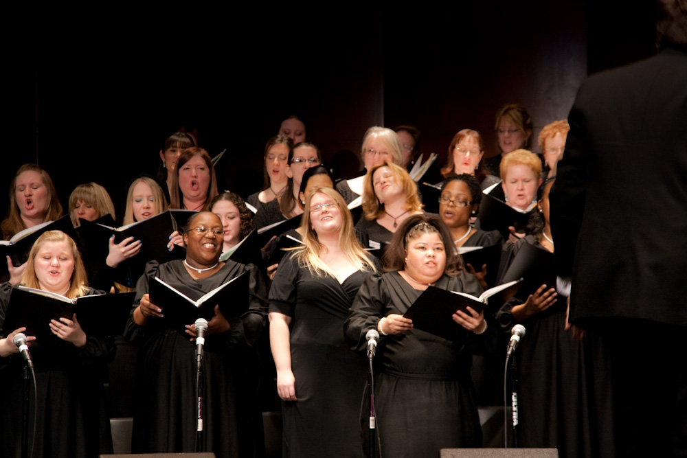 many adults sing in choirs and sing into microphones