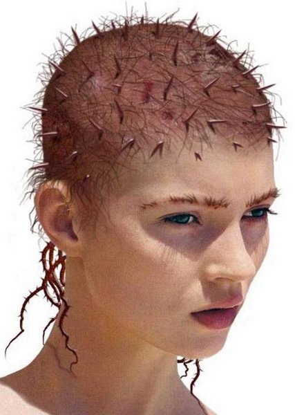 a model with large, shiny spikes on her head