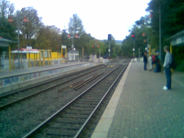 the train track with a person walking along one side