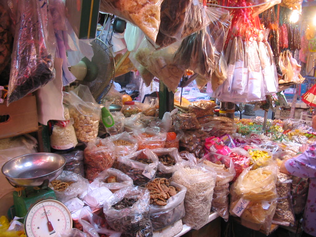 food stand with lots of food items including nuts, cereals and other things