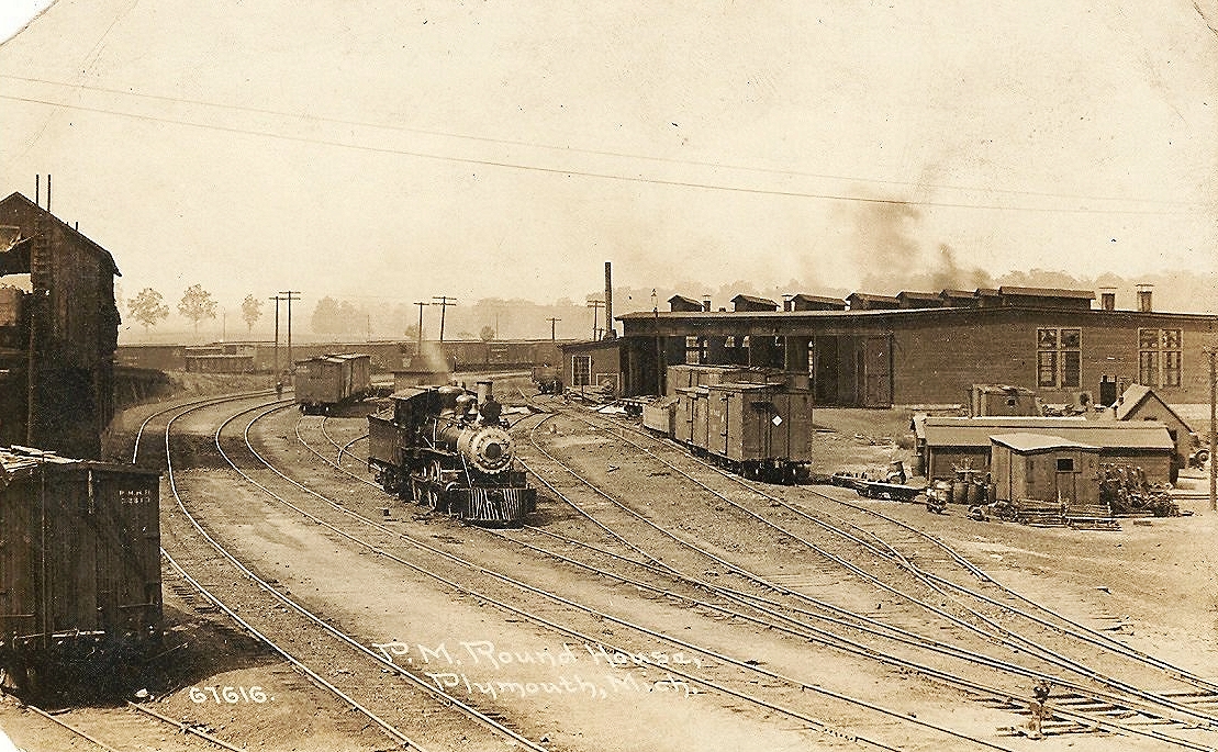 an old pograph of a train traveling on the tracks