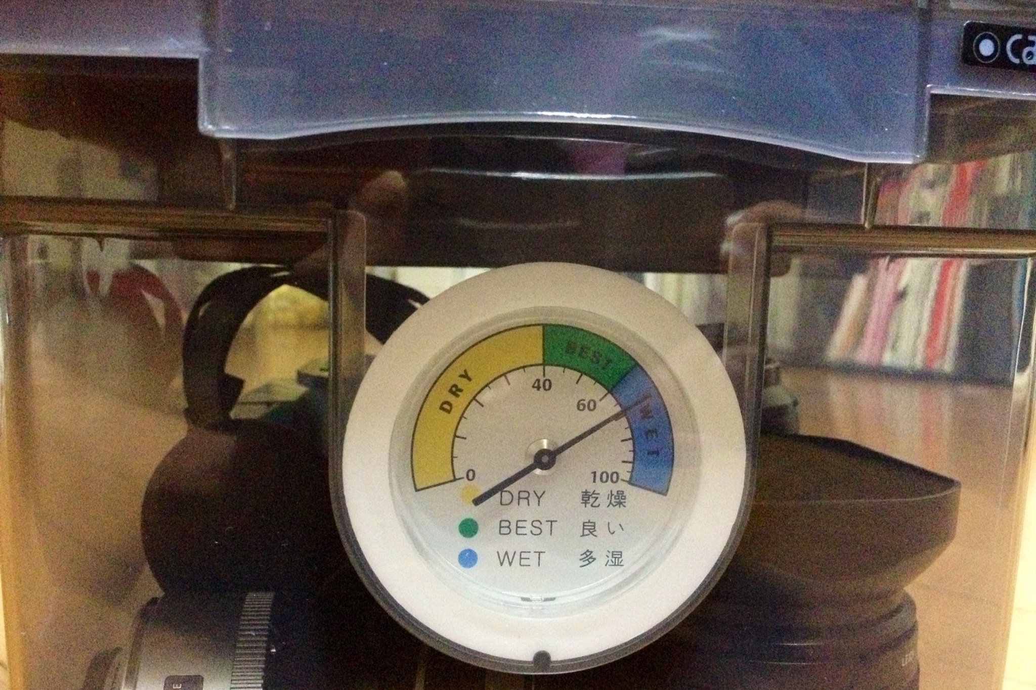 a clock sitting inside of a glass case