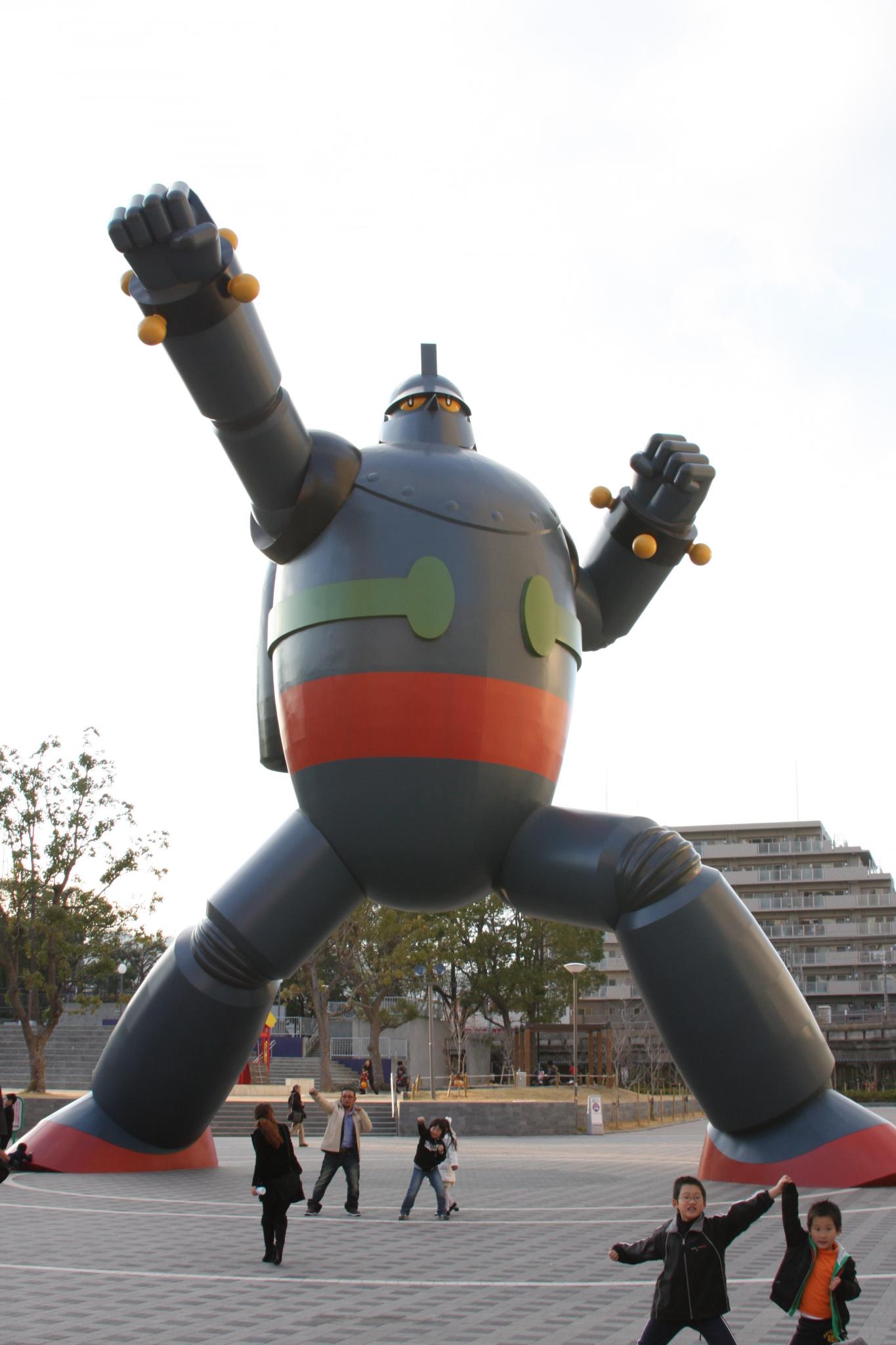 inflatable sculpture of a robot with arms and legs