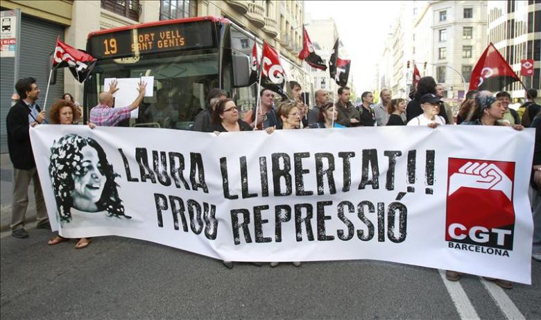 people holding a protest sign with the words labor liberty, proo reppresso
