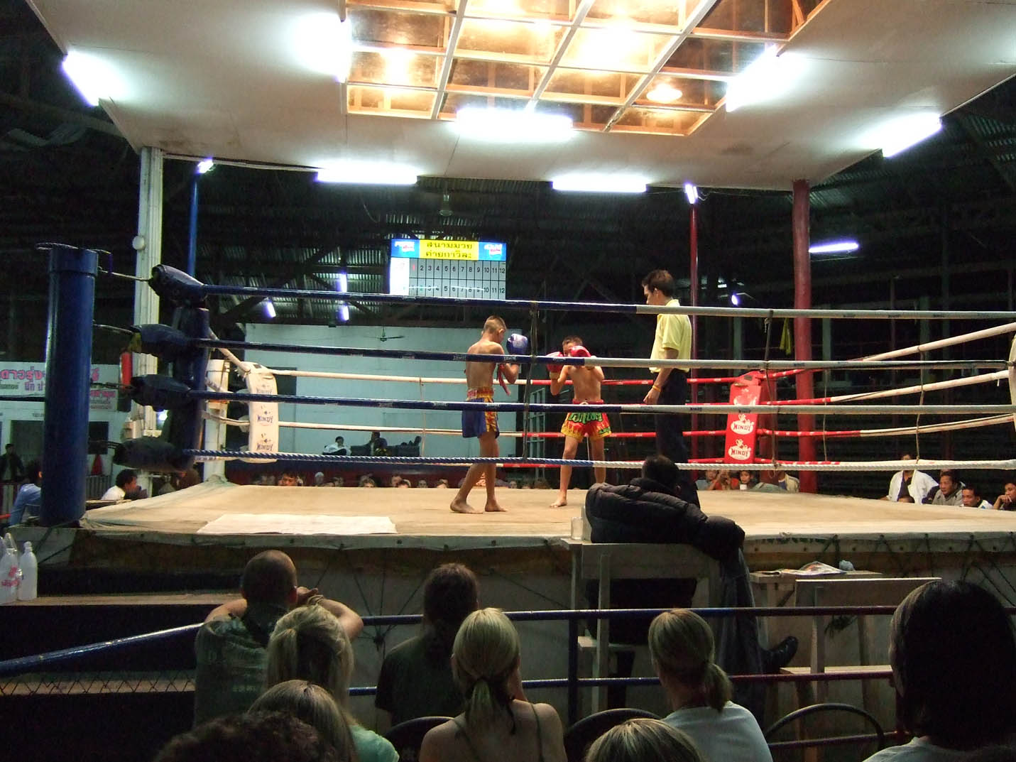 people are standing in an open space with ropes on the floor