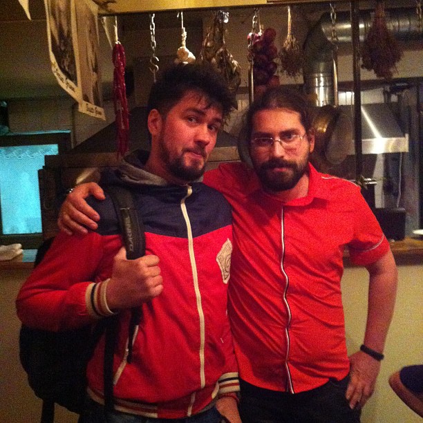 two men posing for the camera with a hairdryer