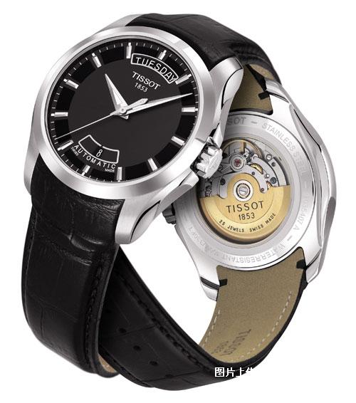 a watch with black and silver accents on the dial