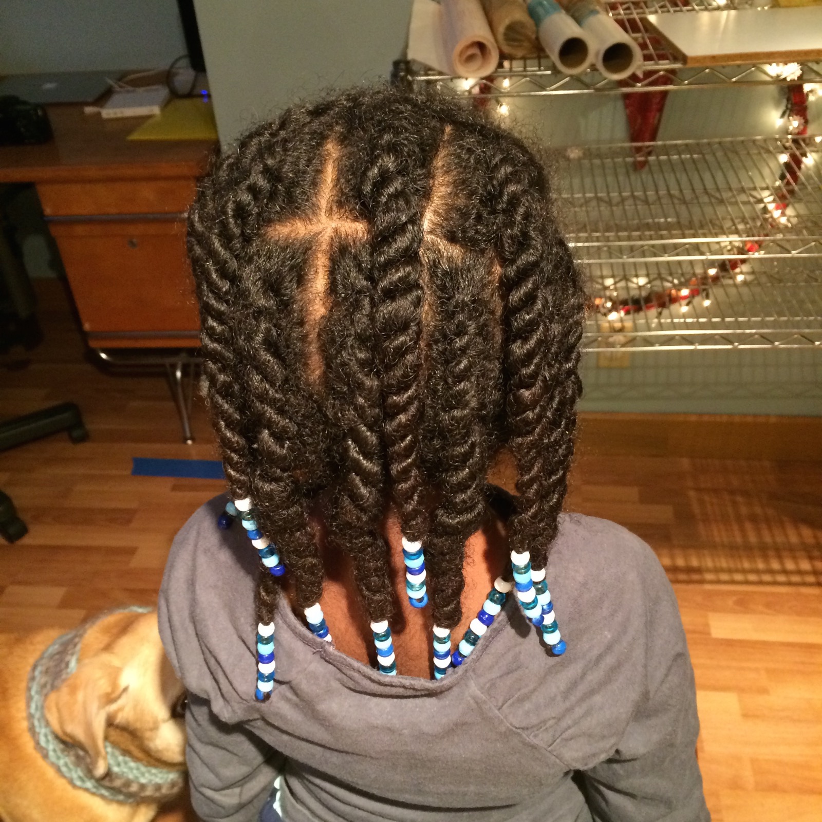 a girl with some nice hairs has blue and white strips on her hair