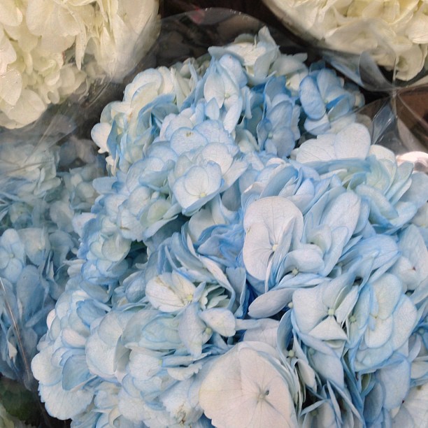 a bouquet of flowers sitting on top of a wooden table