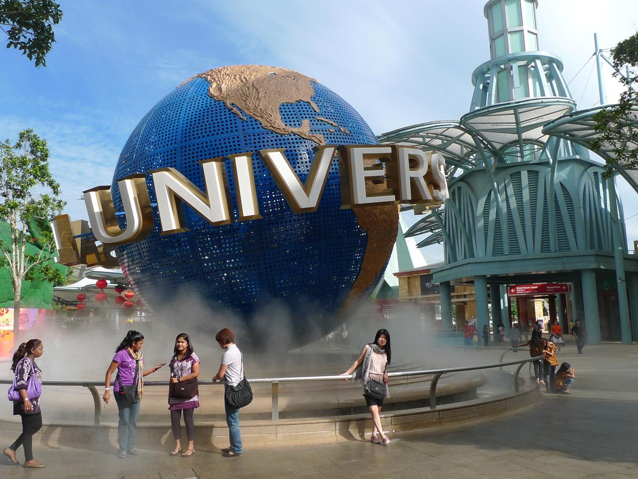 children standing outside the sign to the world in universal