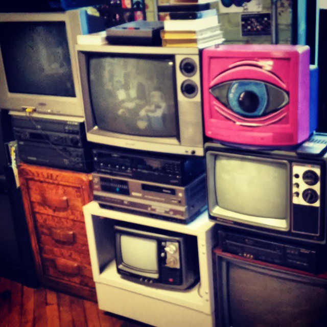a group of tvs that are stacked up