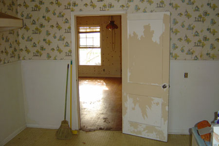 an open door sitting inside of a kitchen