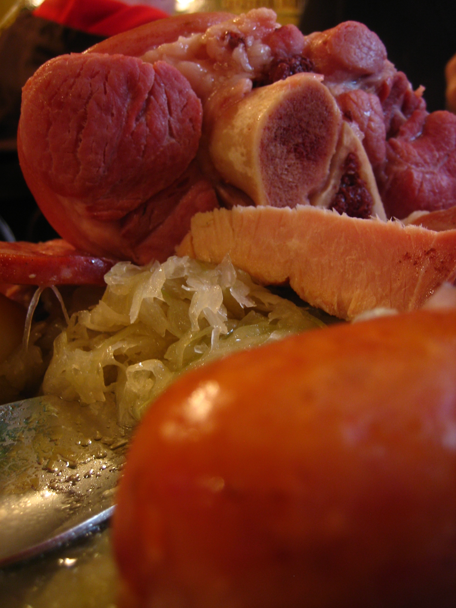 cooked meat on a plate with a spoon