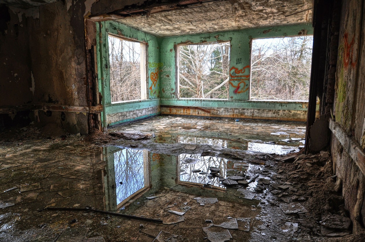 a room with windows that have been boarded