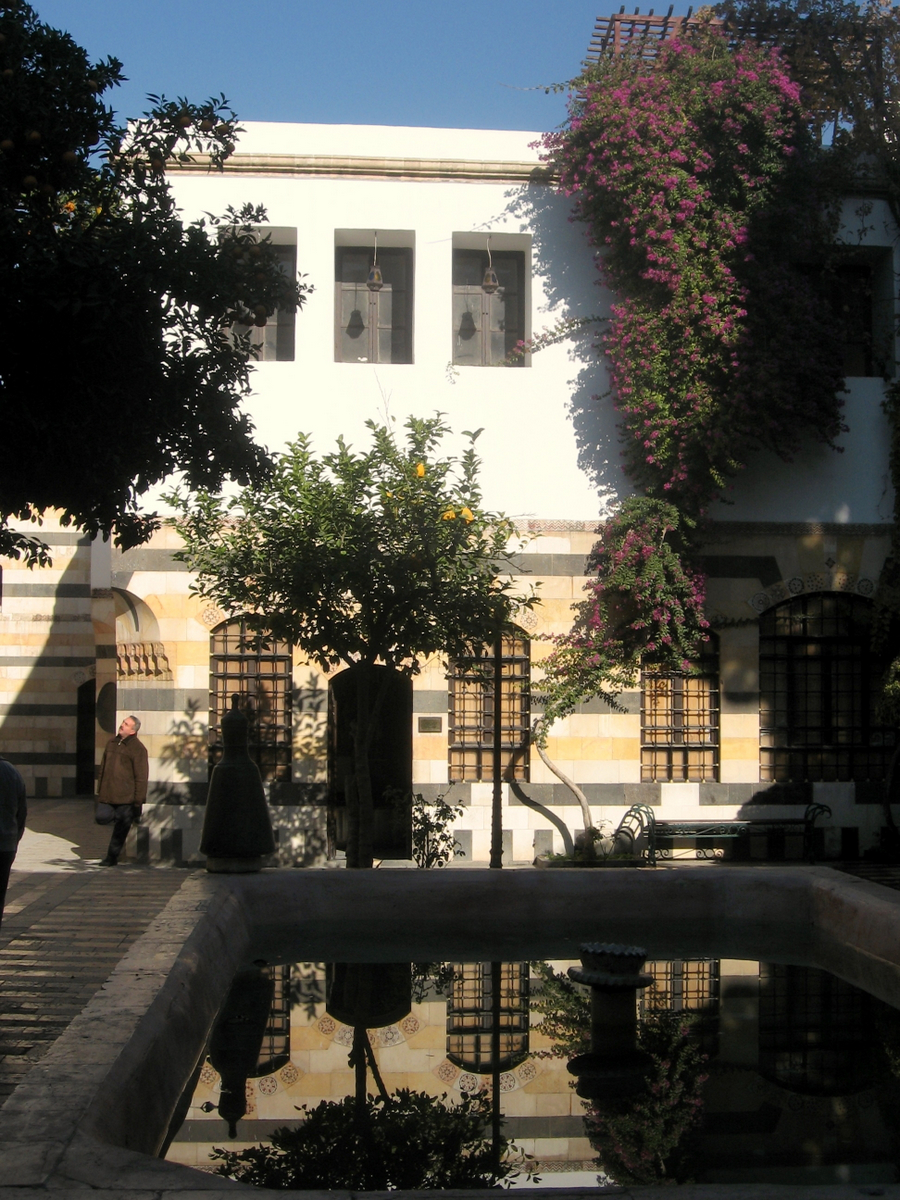 a person is sitting near a building while walking