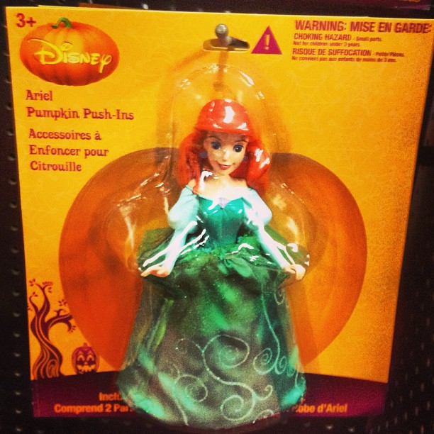 a toy of a green gown is in the box