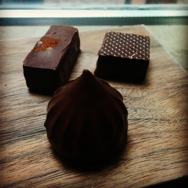 chocolate and a piece of wood on a counter