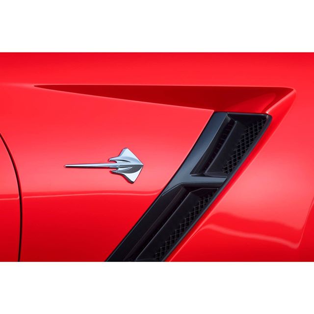 close up of the tail end of a red sports car