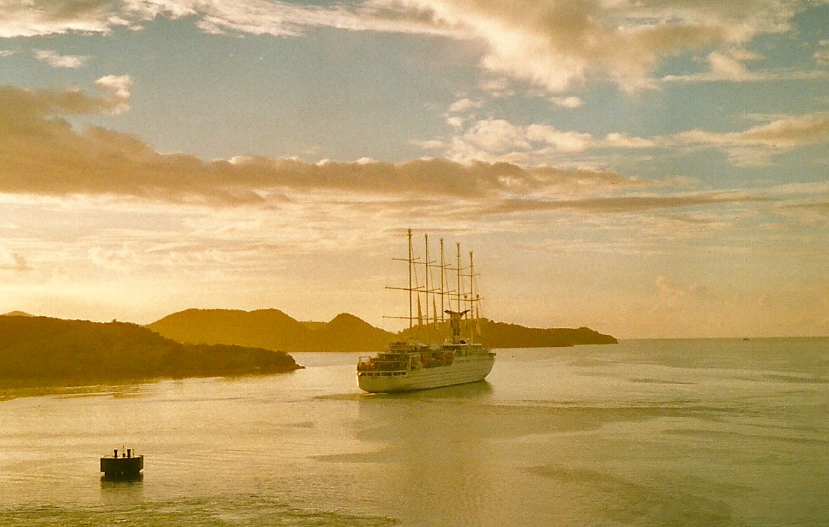 two boats floating on top of a large body of water