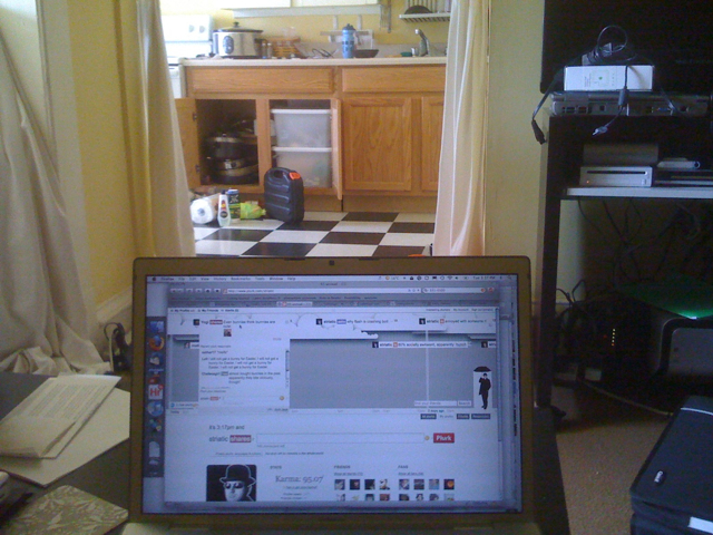 a view from inside the house of an open laptop screen